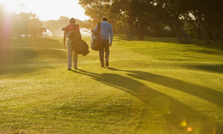 Two people playing on a golf course, the best golf courses in Dublin