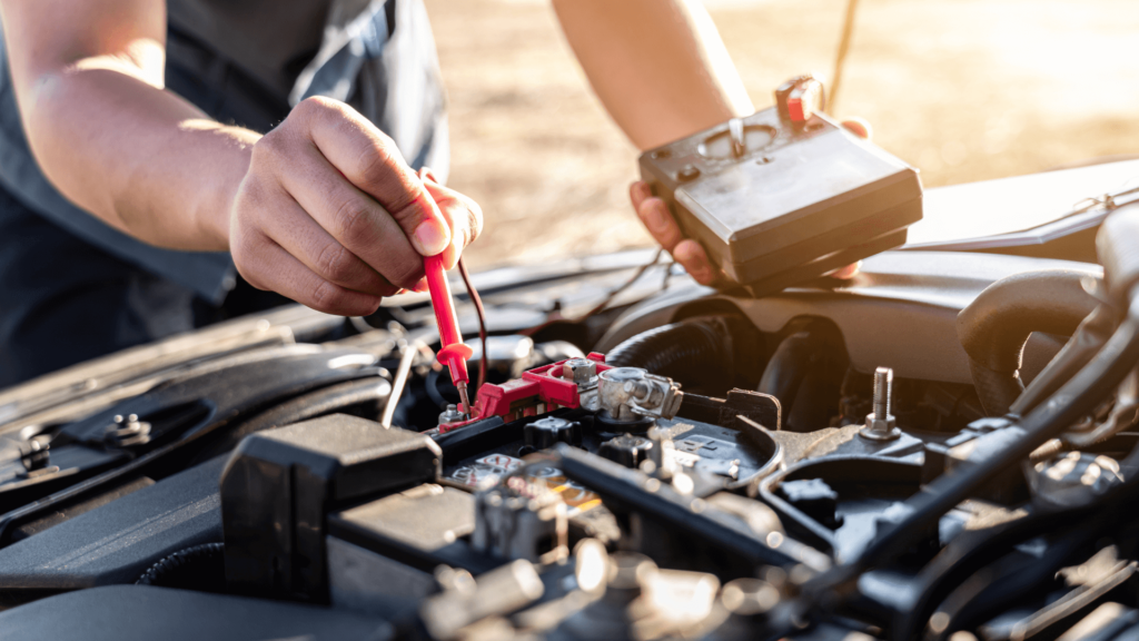 man performing a test on his car battery